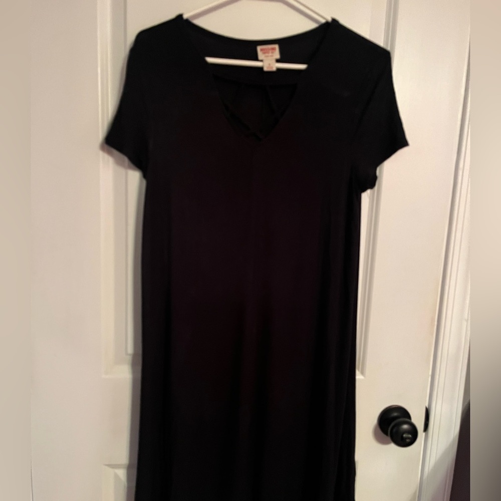 A short sleeve black dress with crisscross front size small.